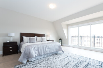 Staged Bedroom Interior with Bed Bright and Airy Well Lit Room