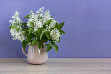 white lilac on a purple background.