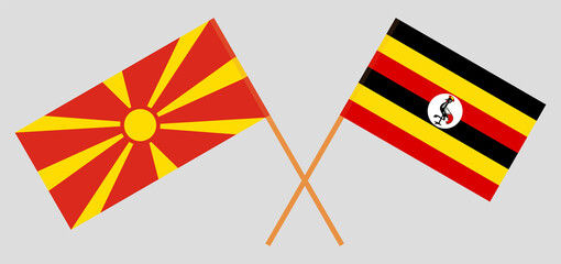 Crossed flags of North Macedonia and Uganda. Official colors. Correct proportion