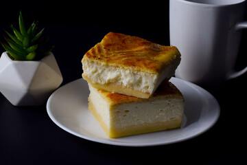 stacked ricotta cheese squares and  a cup of coffee