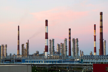 Oil refinery on the background of the blue sky. Industrial area