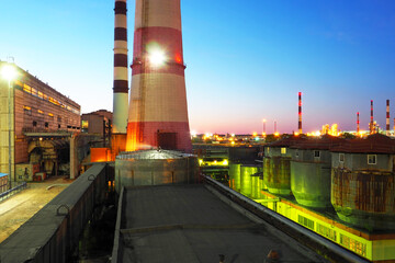Refinery at night. Industrial zone. Factory with night light	