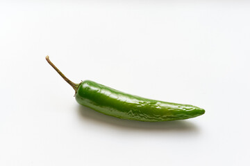 Chile serrano or green single chili pepper isolated on white background