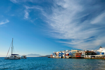 Sunset in Mykonos, Greece, with cruise ship and yachts in the harbor