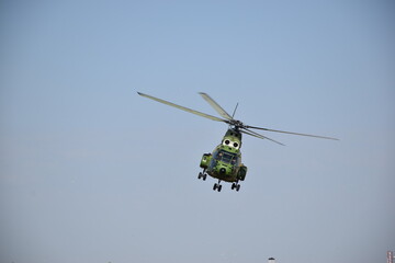 military helicopter in flight