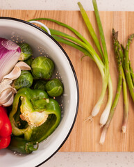Bright colored vegetables in colander 