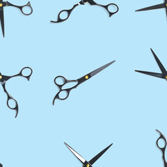 Seamless pattern of black scissors. professional hairdresser black scissors isolated on blue. Black barber scissors, close up. pop art background, for prints or posters