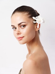 woman with bare shoulders attractive look white flower isolated background