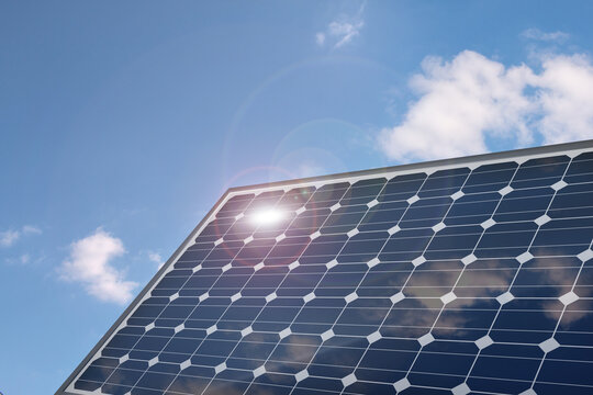Photovoltaic solar power panel on a blue sky. 3d illustration.