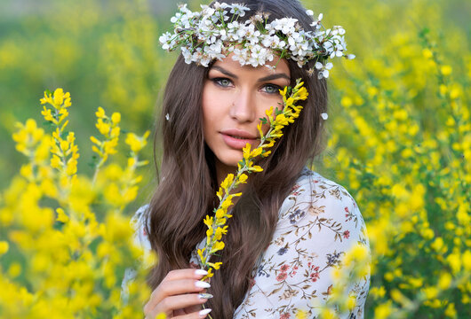 Sexy Face And Flower. Young Sensual Woman With Wreath In Field With Yellow Flowers