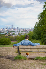 Fototapeta premium man sitting on a bench