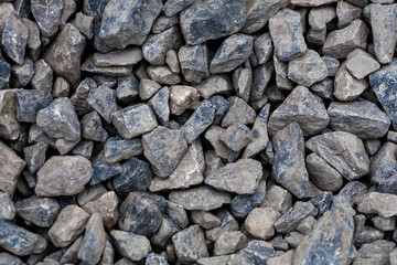 brick rubble debris on construction site. inorganic crushed stone, non-round, loose material with grains. Artificially obtained by crushing coarse-grained rocks and pebbles, accidentally mined