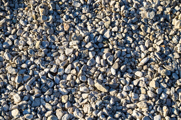 Pebble beach. Closeup of the stones near sea. Stones Texture.
