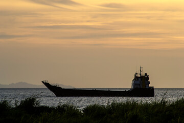 Sunset Background with ships silhouette