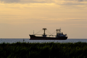 Sunset Background with ships silhouette