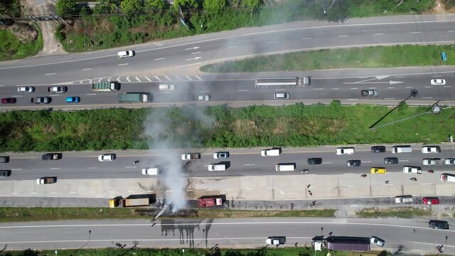 Aerial View: Rescue Team Of Firefighters And Paramedics Work On A Car Crash Traffic Accident Scene.