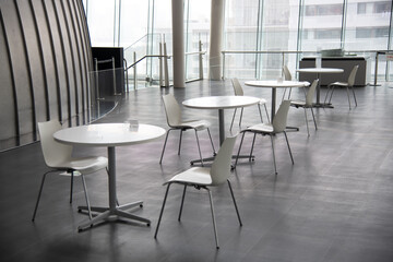 The chair and table is arranged in new normal style for social distancing which one of the Coivid-19 countermeasure and prevention. This layout is for people gathering and meeting with keep distance.
