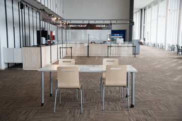 Chairs and table is arranged in new normal style for social distancing which one of the Coivid-19 measure and prevention. `Layout is for people gathering and meeting with keep distance.