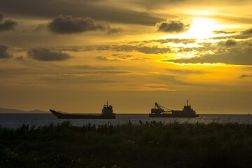 Sunset Background with ships silhouette