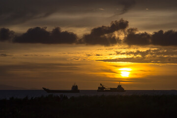 Sunset Background with ships silhouette