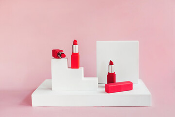 Mockup of red lipsticks on a white staircase with geometric shapes and a podium. Background for...