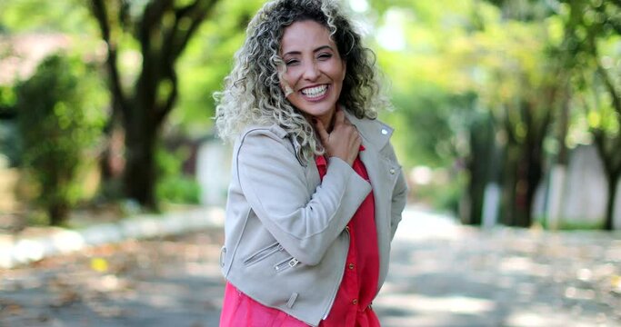 Fun happy person dancing celebrating success. Hispanic person dances in joy