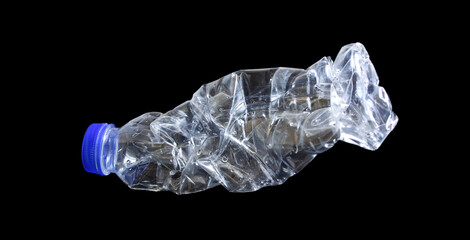 Clear plastic water bottle that the condition is damaged on a black background.