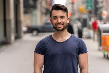 Young caucasian man in city  smile happy face portrait