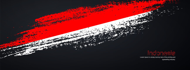 Fototapeta na wymiar Grunge brush of Indonesia flag on shiny black background. Creative glitter sparkle brush paint vector illustration