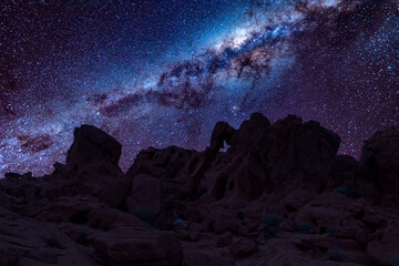 An elephant-shaped rock formation in Valley of Fire State Park in Nevada at night under the stars...