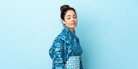 Woman wearing kimono over isolated background . Portrait