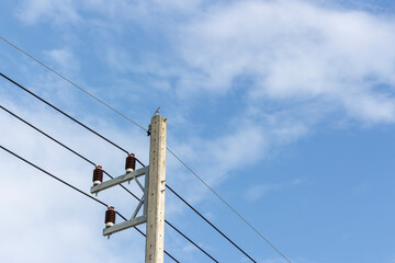 high voltage electric wires installed on insulator pin front of the sky background