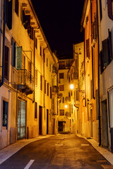Night view of narrow street at historic centre of Verona (Italy) at dawn