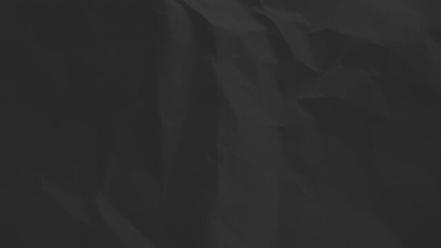 Crumpled sheet of paper. Live wallpaper abstract background. Slow motion. Place for text, title. Can use in vertical position