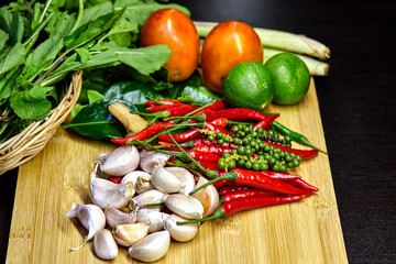 the variety of spices on a wooden board
