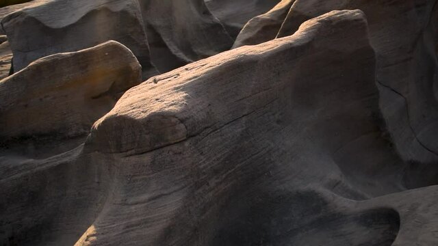 View of  sunset light over large naturally carved rocks at river canyon. Khari river, Kutch, India