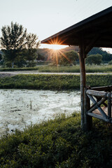 Sunset and river wood house light