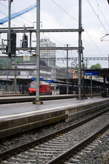 Aarau main railway station with train at a rainy summer day. Photo taken June 4th, 2021, Aarau, Switzerland.