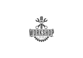 logo for workshop with gear and piston illustration