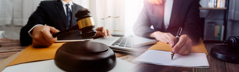 justice and law concept.Male judge in a courtroom on wooden table and Counselor or Male lawyer working in office. Legal law, advice and justice concept.