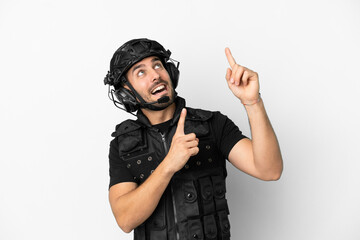 Young caucasian swat isolated on white background pointing with the index finger a great idea