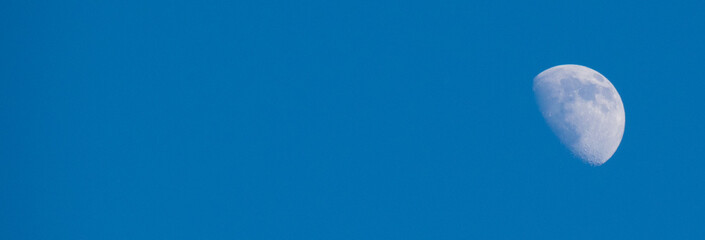 Beautiful sky with the moon, copy space, gentle blue background with place for text, banner format