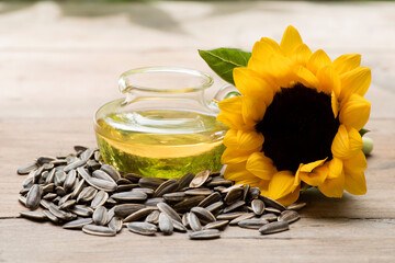 Dried sunflower seeds ,flower and oil  isolated on white background.