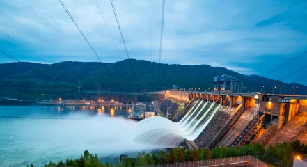 Foto op Canvas view of the hydroelectric dam, water discharge through locks © evgenii_v