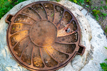 Sewer cast-iron manholes in the city.