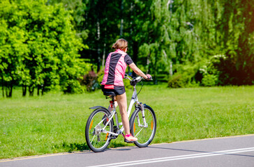 Cyclist ride on the bike path in the city Park

