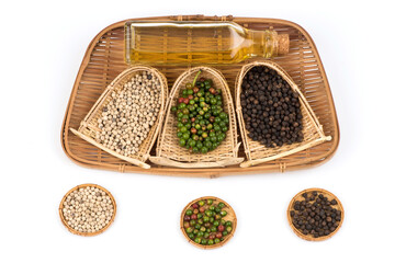 Fresh,black, white pepper and oil isolated on white background.