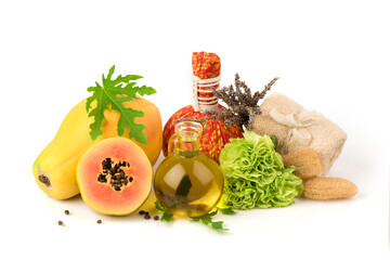 Face mask with papaya fruits and oil isolated on white background.