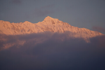 Fototapeta premium sunset over the mountains with fog in Serre Ponçon, France