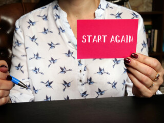  Financial concept meaning START AGAIN with phrase on the sheet. Business concept about  begin...